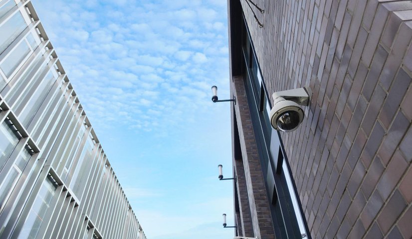 CCTV security camera mounted on a commercial building exterior