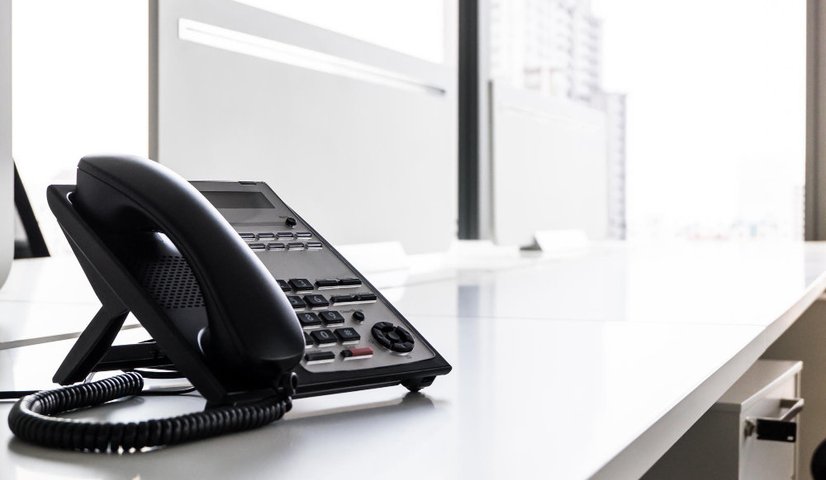 VoIP office phone handset on a business desk